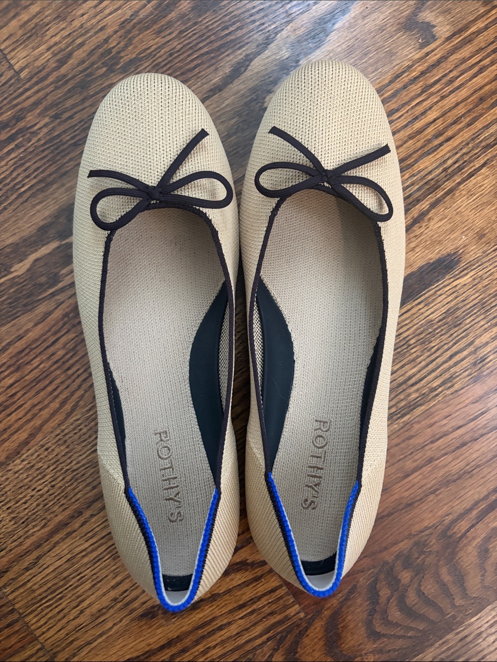 Rothy's Beige Knit Ballet Flats with Black Trim and Blue Heel Accent